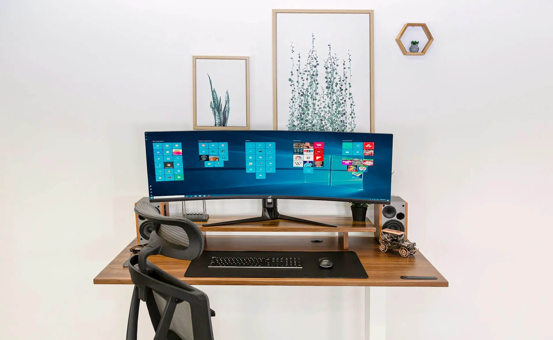 A tidy home office desk setup with a monitor and chair.